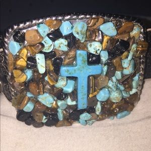 Cross belt buckle with black distressed belt